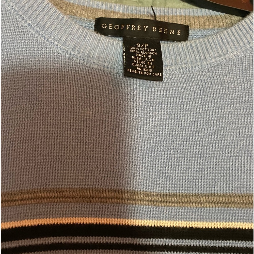 blue sweater w/ white, grey, black stripes